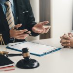 Image lawyer businessman sitting at the office with a woman customer explaining the agreement of advice.