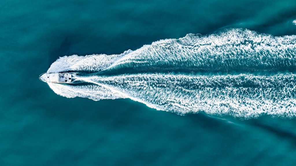 Aerial view of sea, blue waters and coast of Brighton, East Sussex, UK