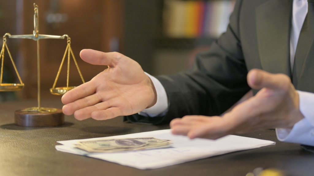 Close up of Upset Middle Aged Lawyer Counting Money